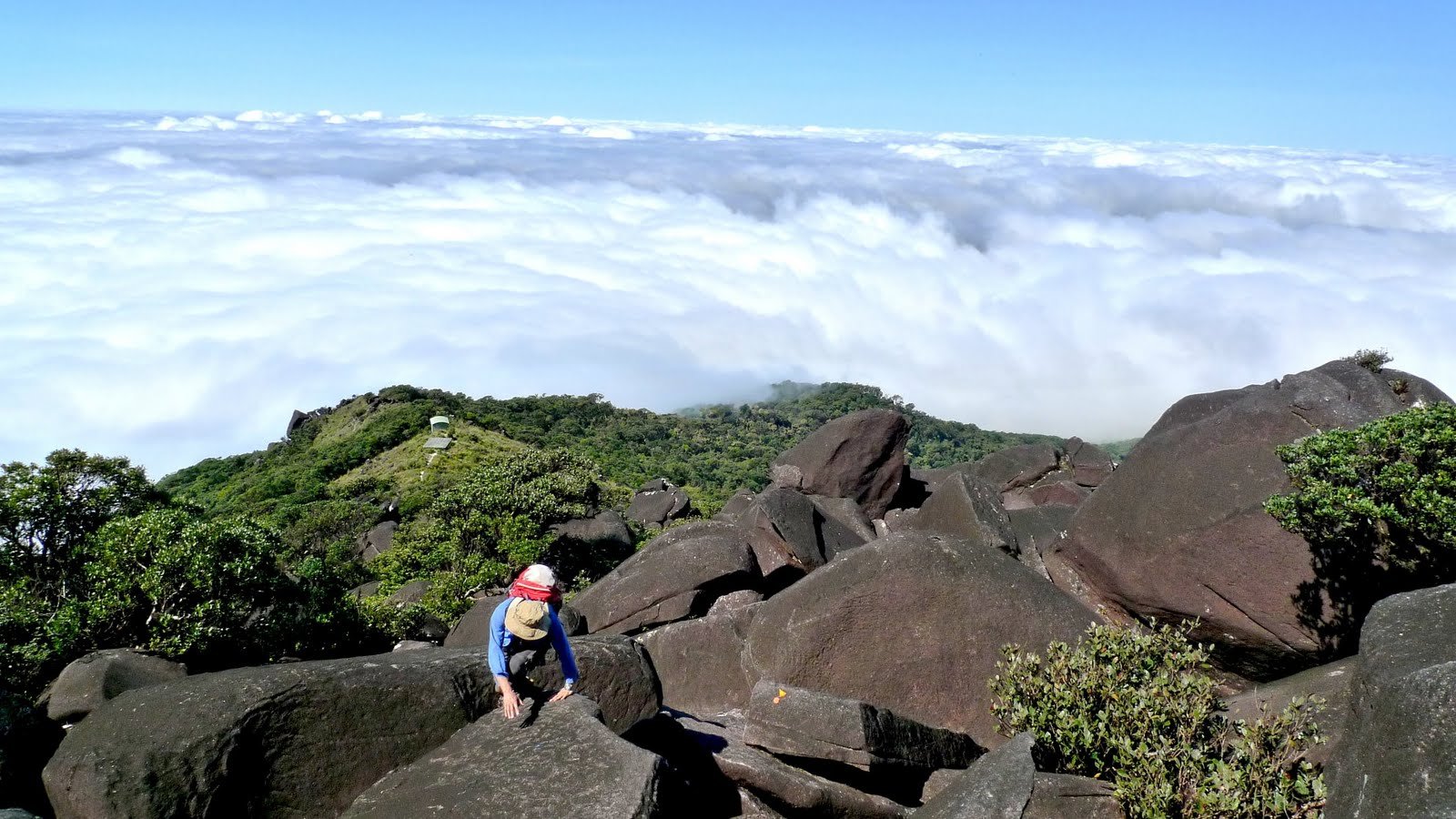25 Bartle Frere, Paul clambering over boulders