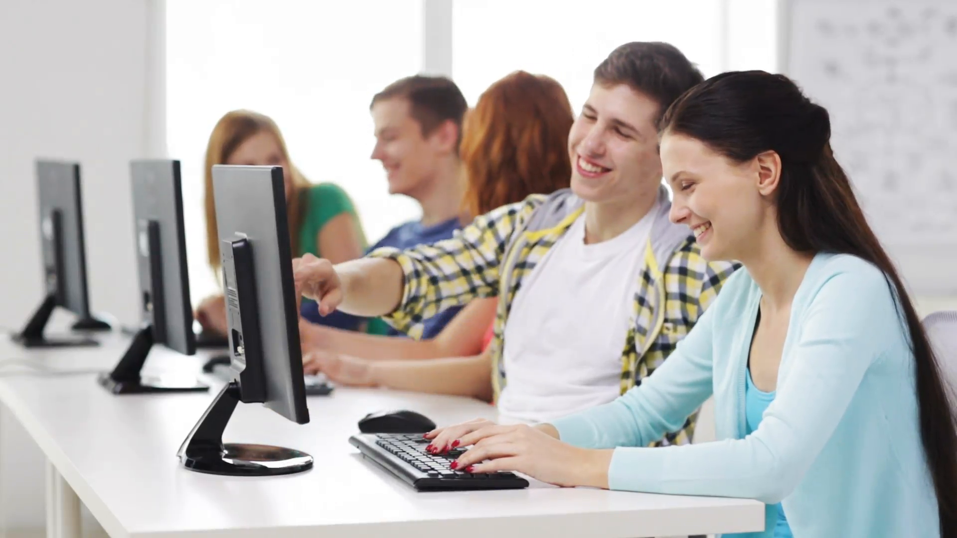 education-technology-school-and-people-concept-group-of-smiling-students-working-with-computers-in-computer-class-at-school_n_zftvi3g__F0000